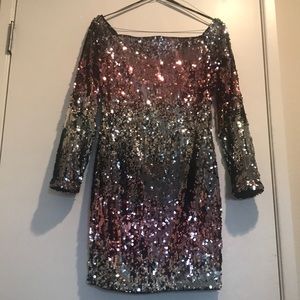Off shoulder pink and silver sequined mini dress.